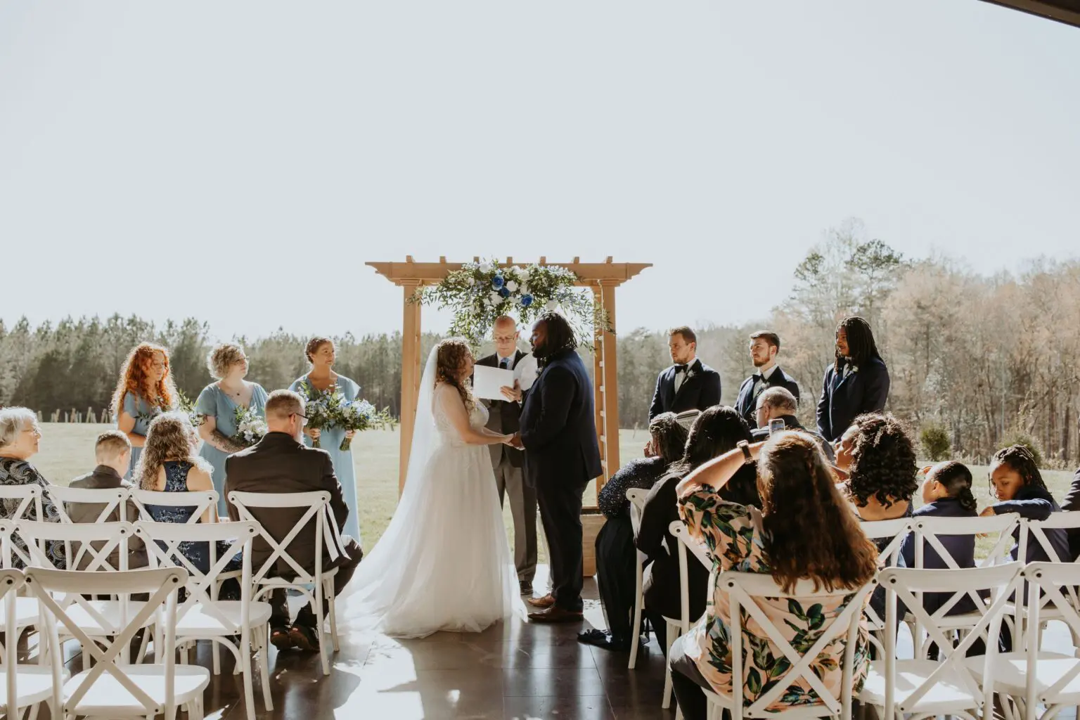 A couple getting married in front of their guests.