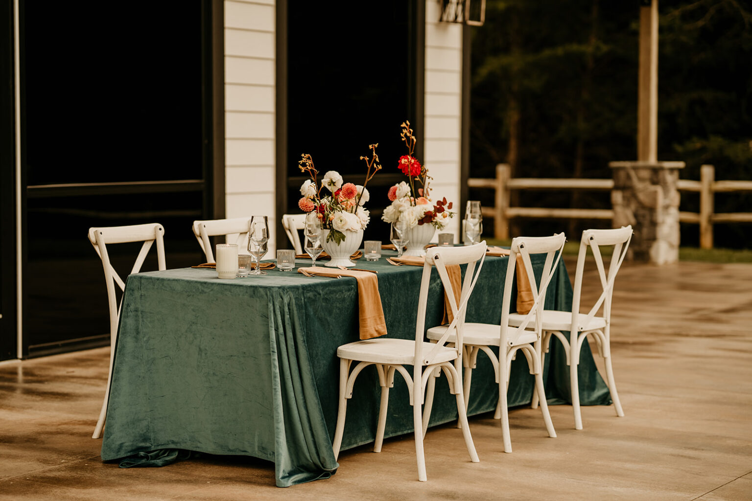 A table with flowers and plates on it