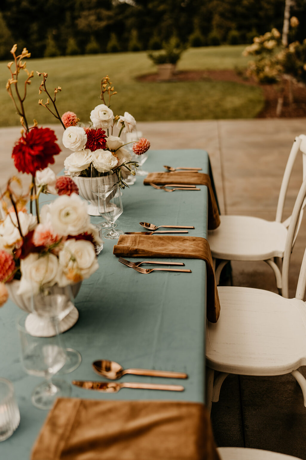 A table with flowers and silverware on it