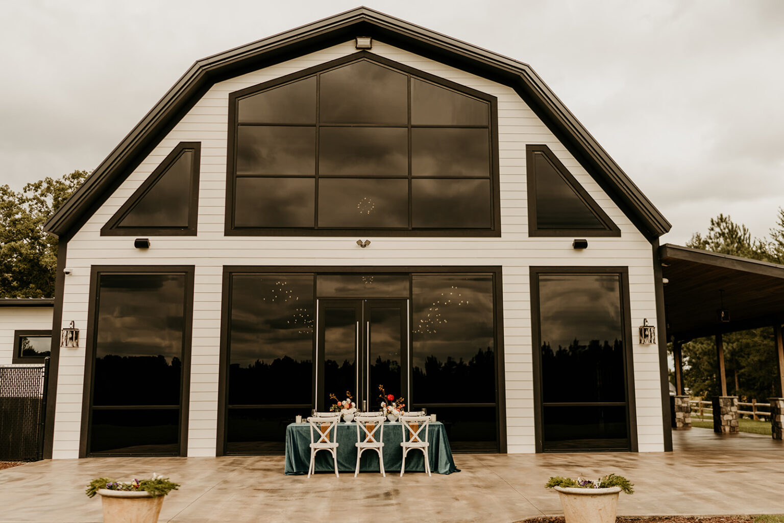 A table with two chairs and a large window.