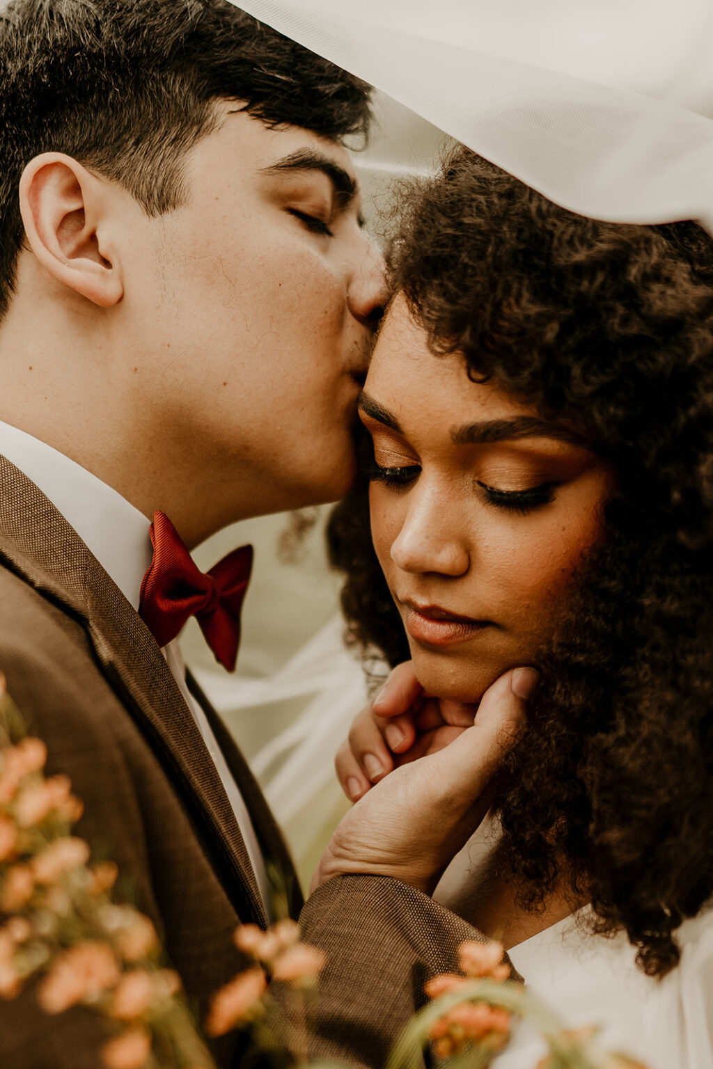 A man and woman kissing each other.