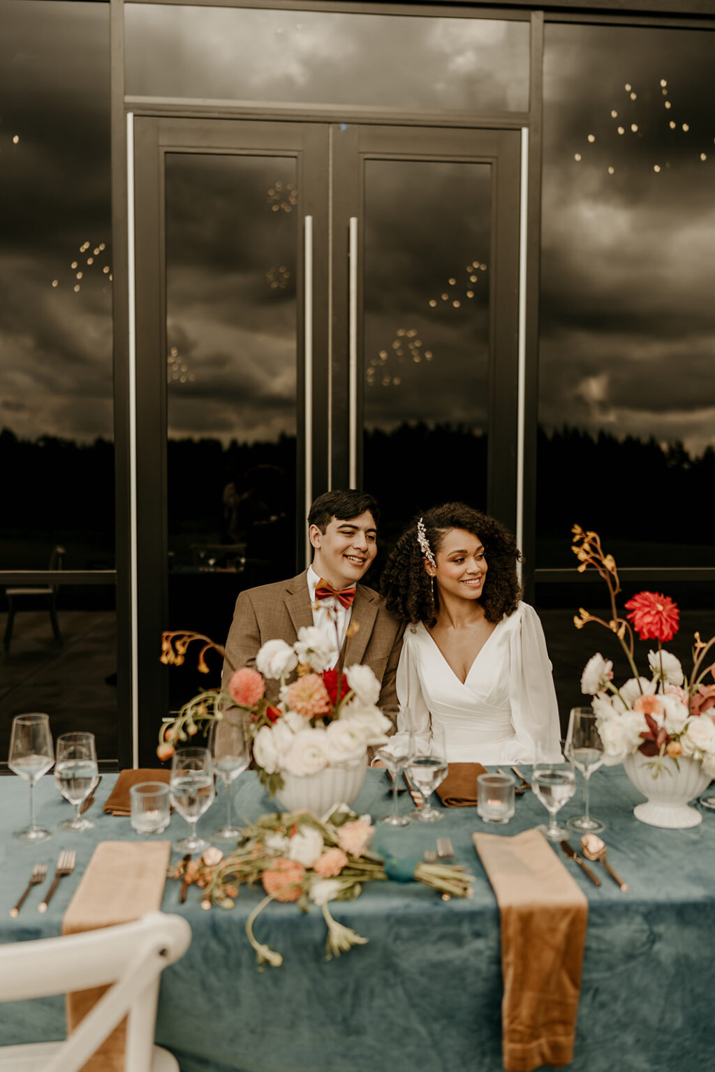 A man and woman sitting at the table together.