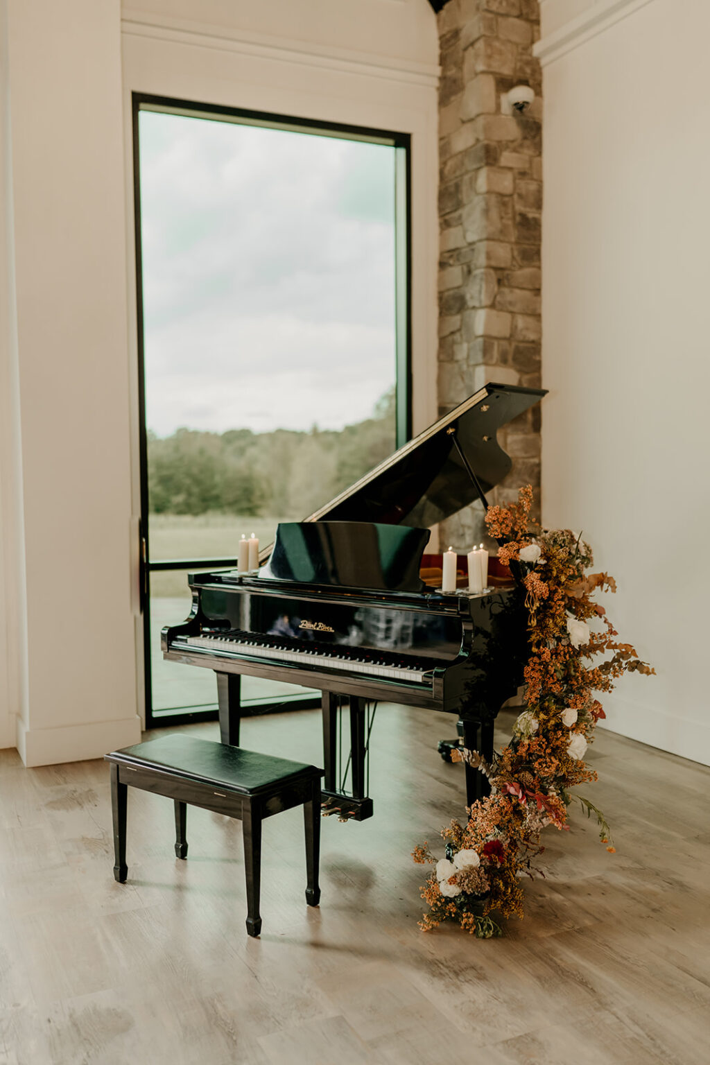 A piano sitting in front of a window.