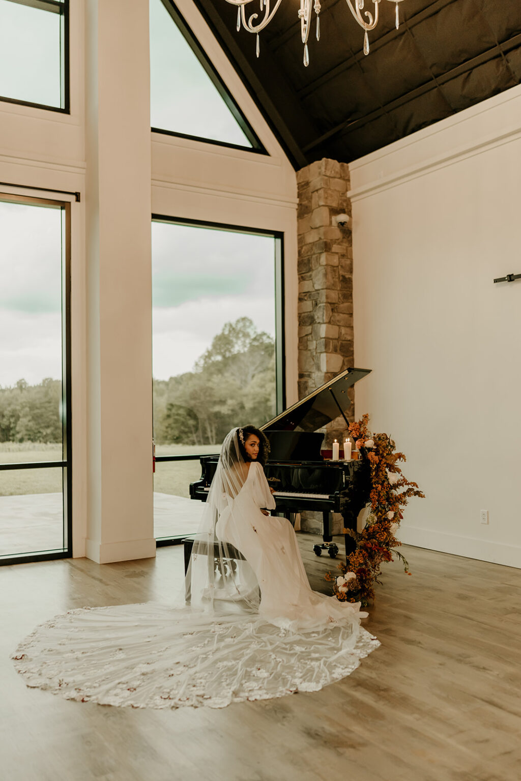 A bride sitting in front of a piano