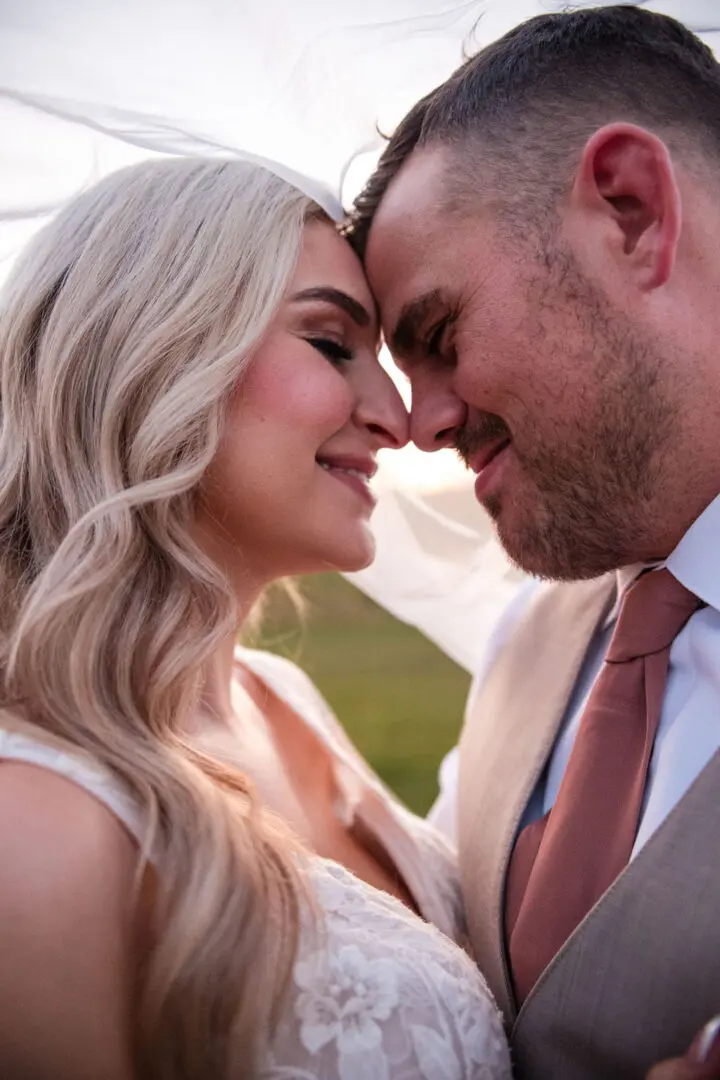 A man and woman smiling at each other.