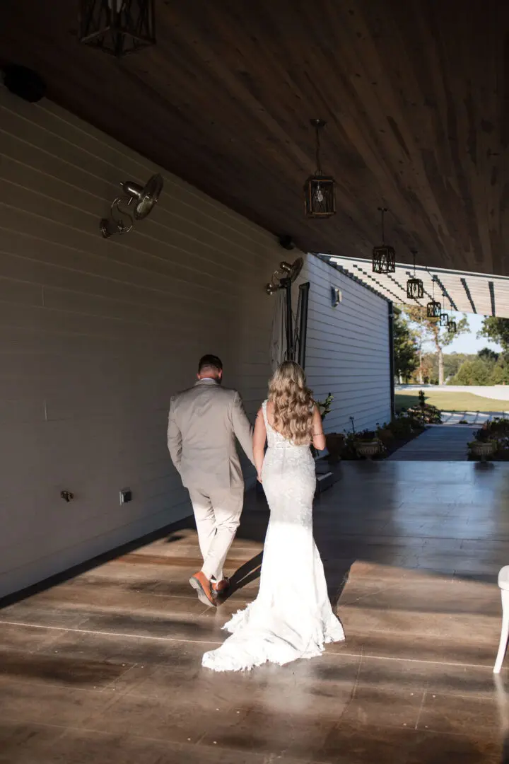 A bride and groom walking down the aisle.