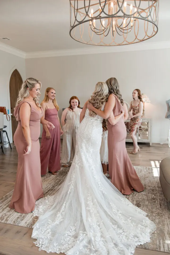 A bride and her bridesmaids getting ready for the wedding.