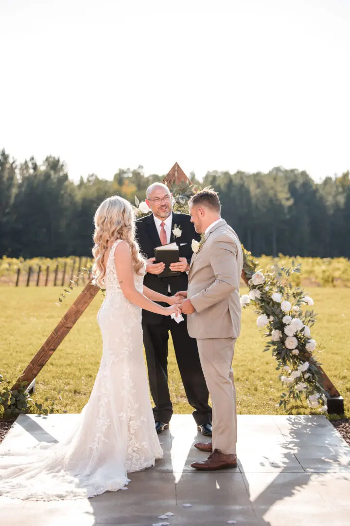 A couple getting married in front of the officiant.