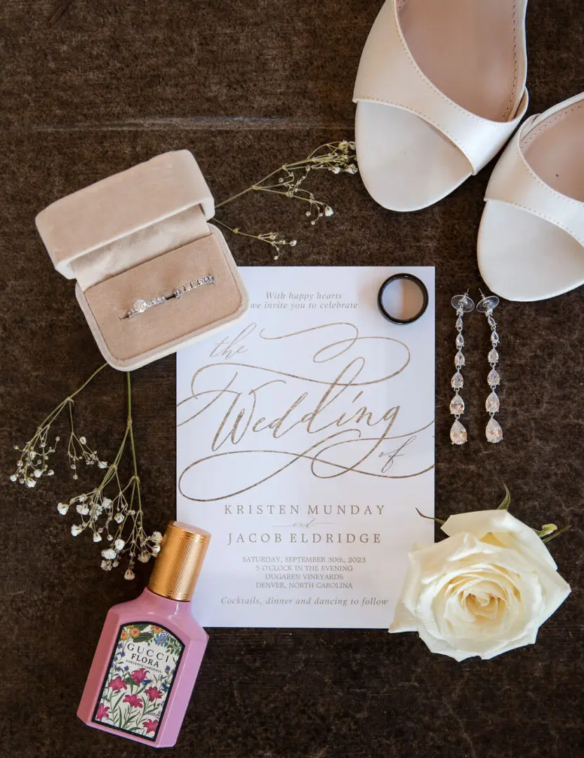 A wedding invitation sitting on top of the floor.