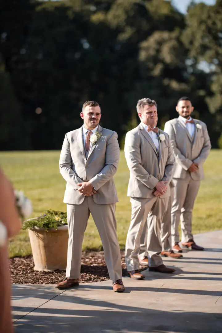 A group of men in suits standing next to each other.