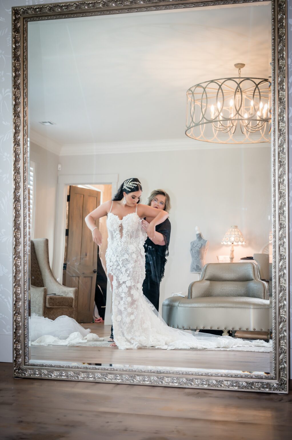 A woman is standing in front of a mirror