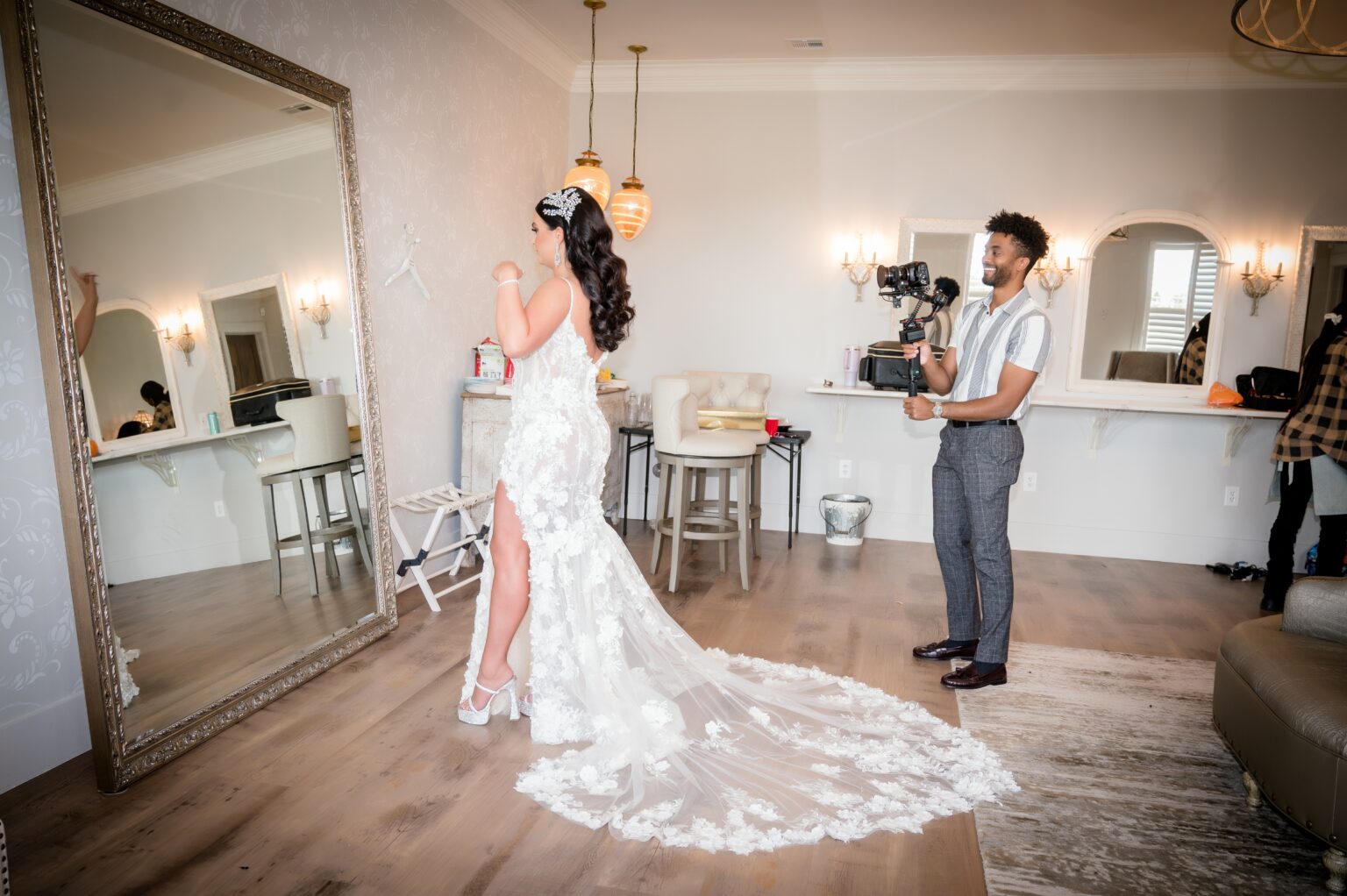 A man and woman in wedding dress taking pictures.