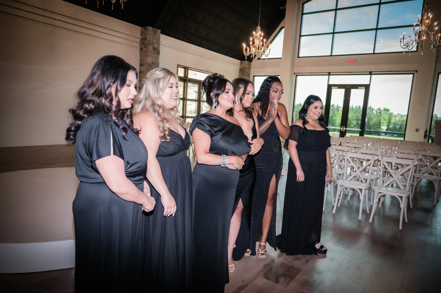 A group of women standing in front of a table.