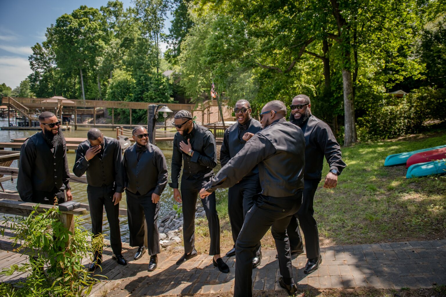 A group of men standing around in the woods.