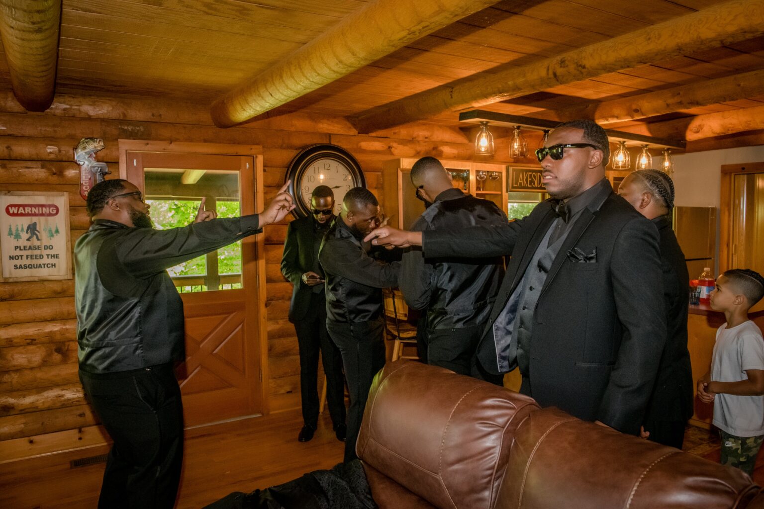 A group of men in suits and ties standing around.