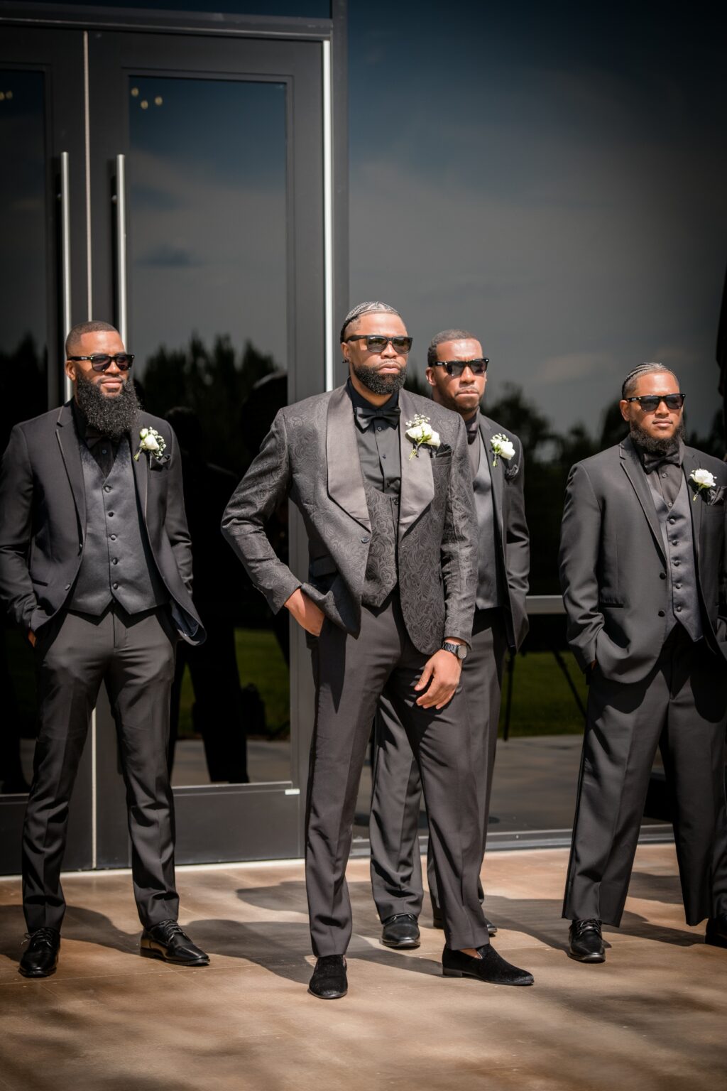 A group of men in suits and ties standing next to each other.