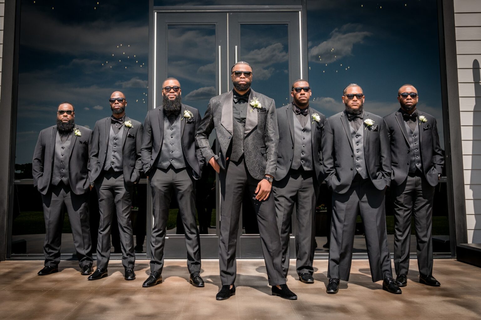 A group of men in suits posing for the camera.