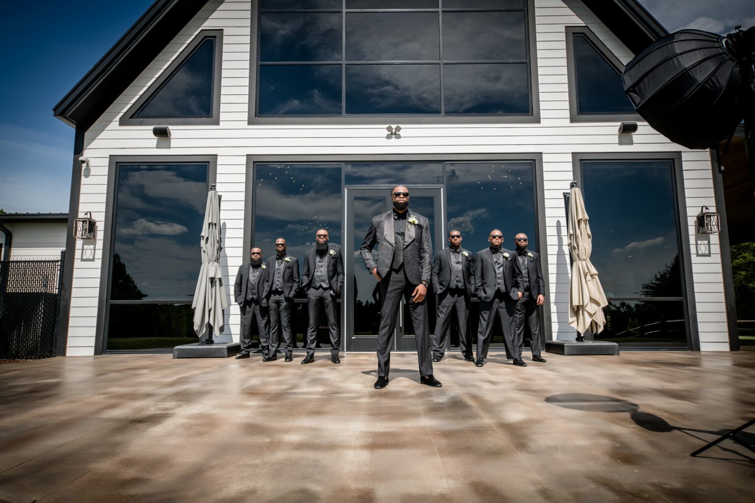 A group of men in suits standing outside.