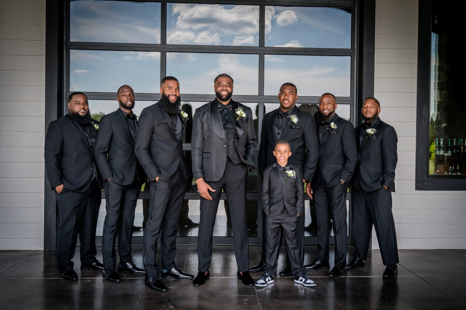 A group of men in suits posing for a picture.