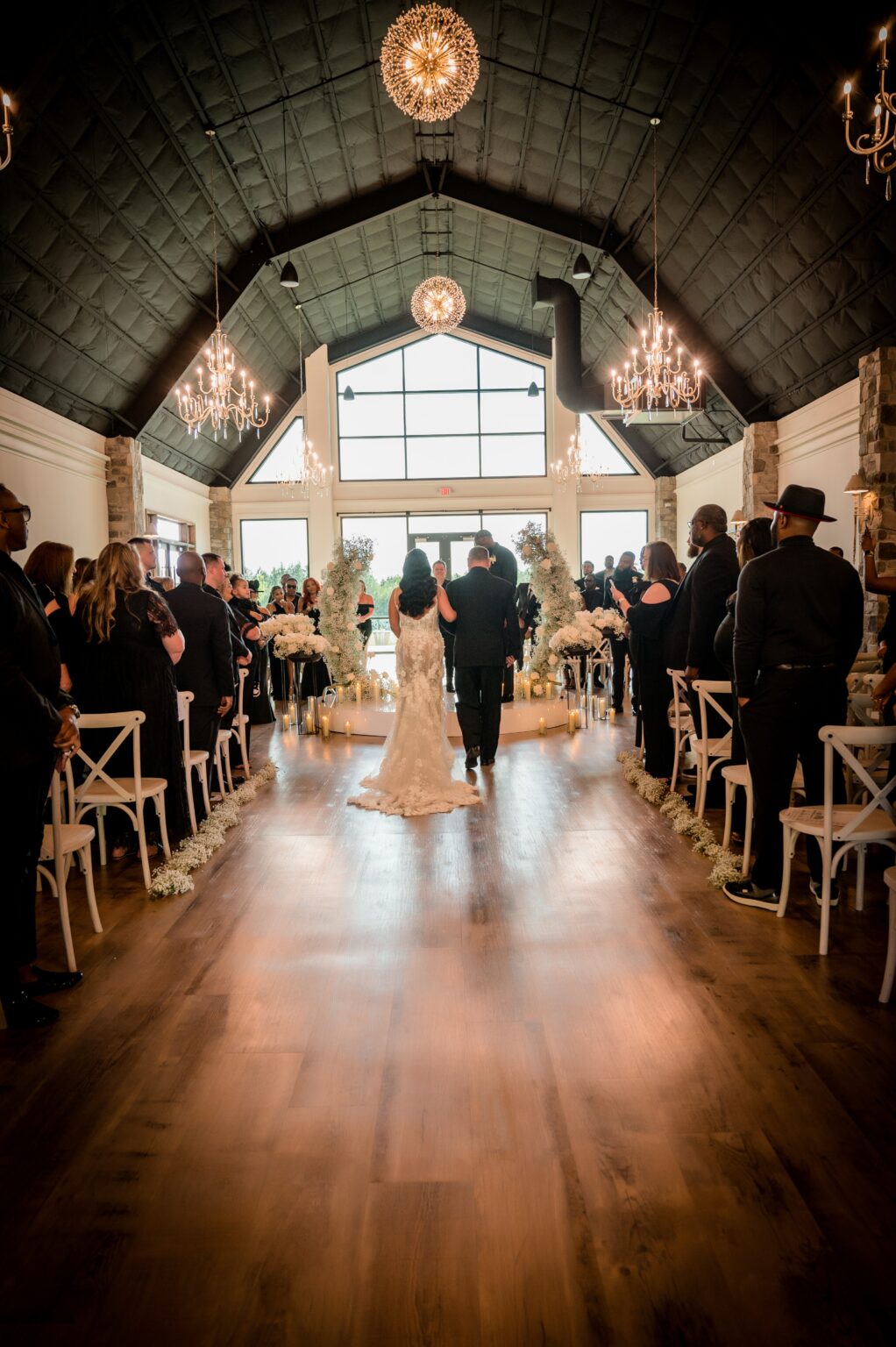 A bride and groom walking down the aisle.