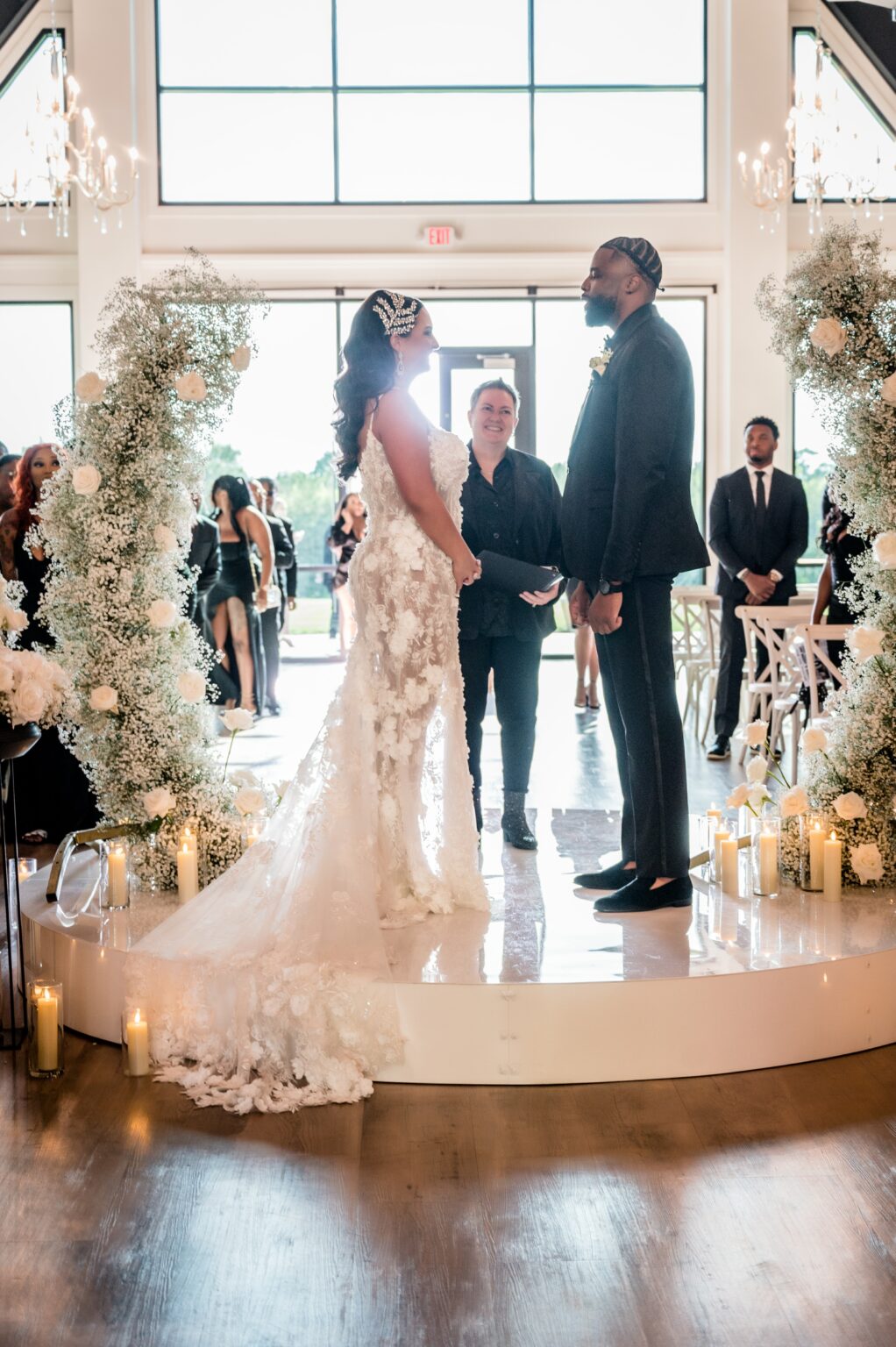 A couple getting married in front of the crowd.