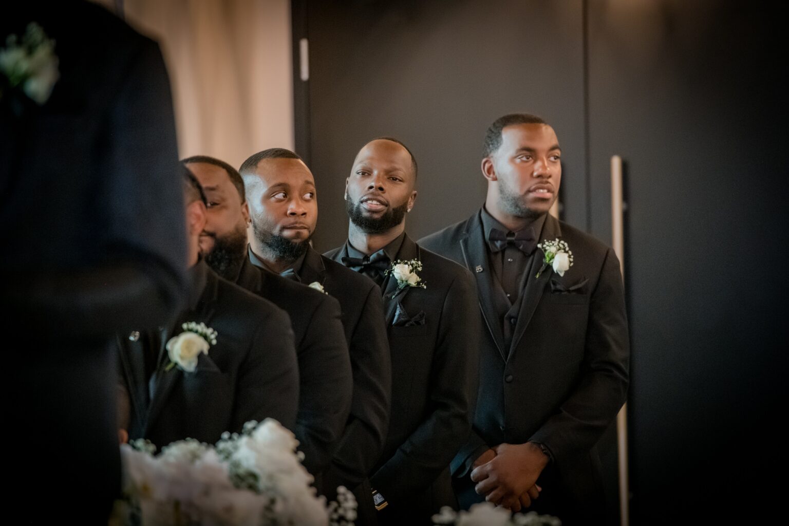 A group of men in suits and ties standing next to each other.