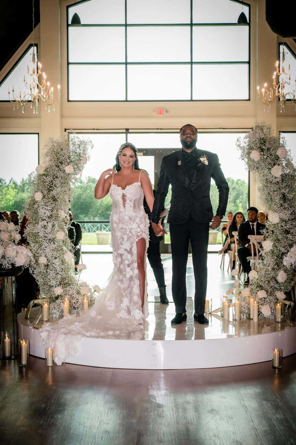 A man and woman standing on top of a stage.