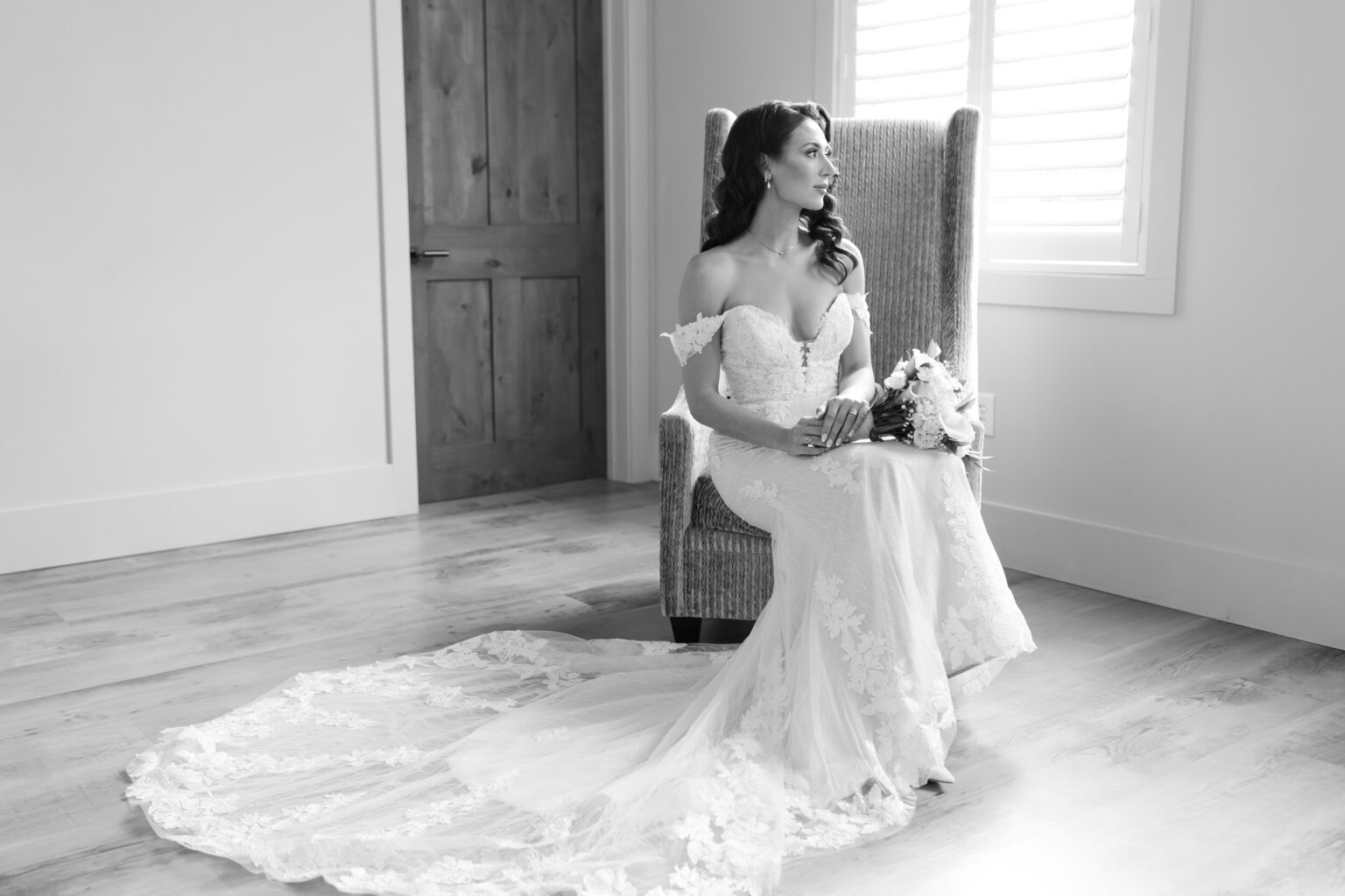 A bride sitting in her wedding dress on the floor